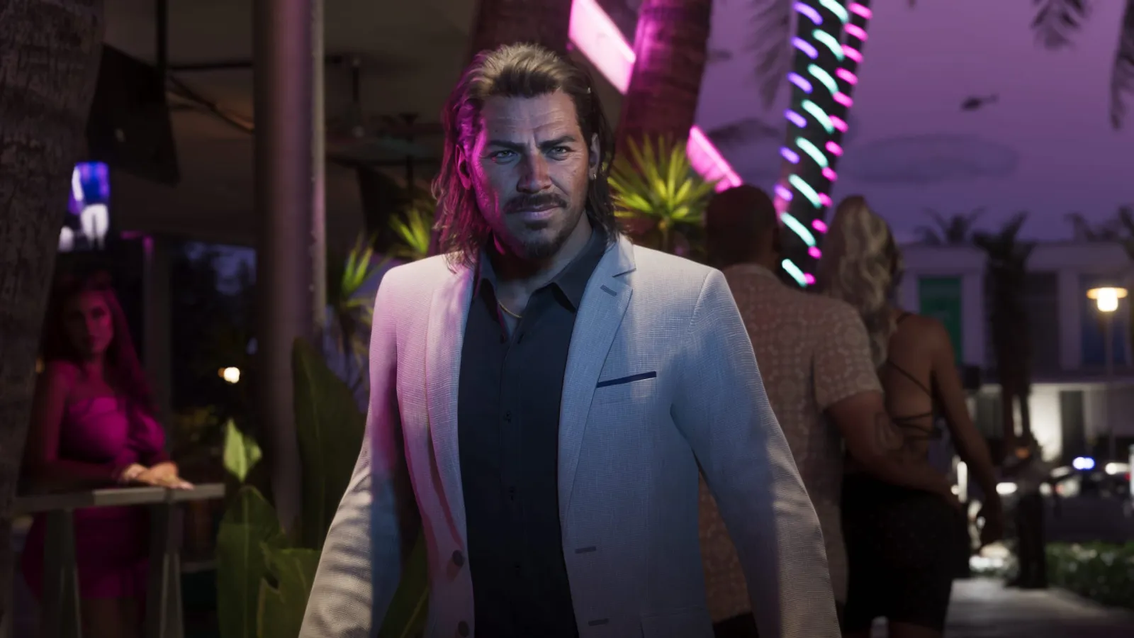 Raul Bautista, a GTA 6 character in a suit, on a neon-pink Vice City street at night